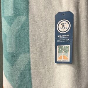 This is a LIFE IS GOOD  60” x 70” plush throw from Berkshire blanket